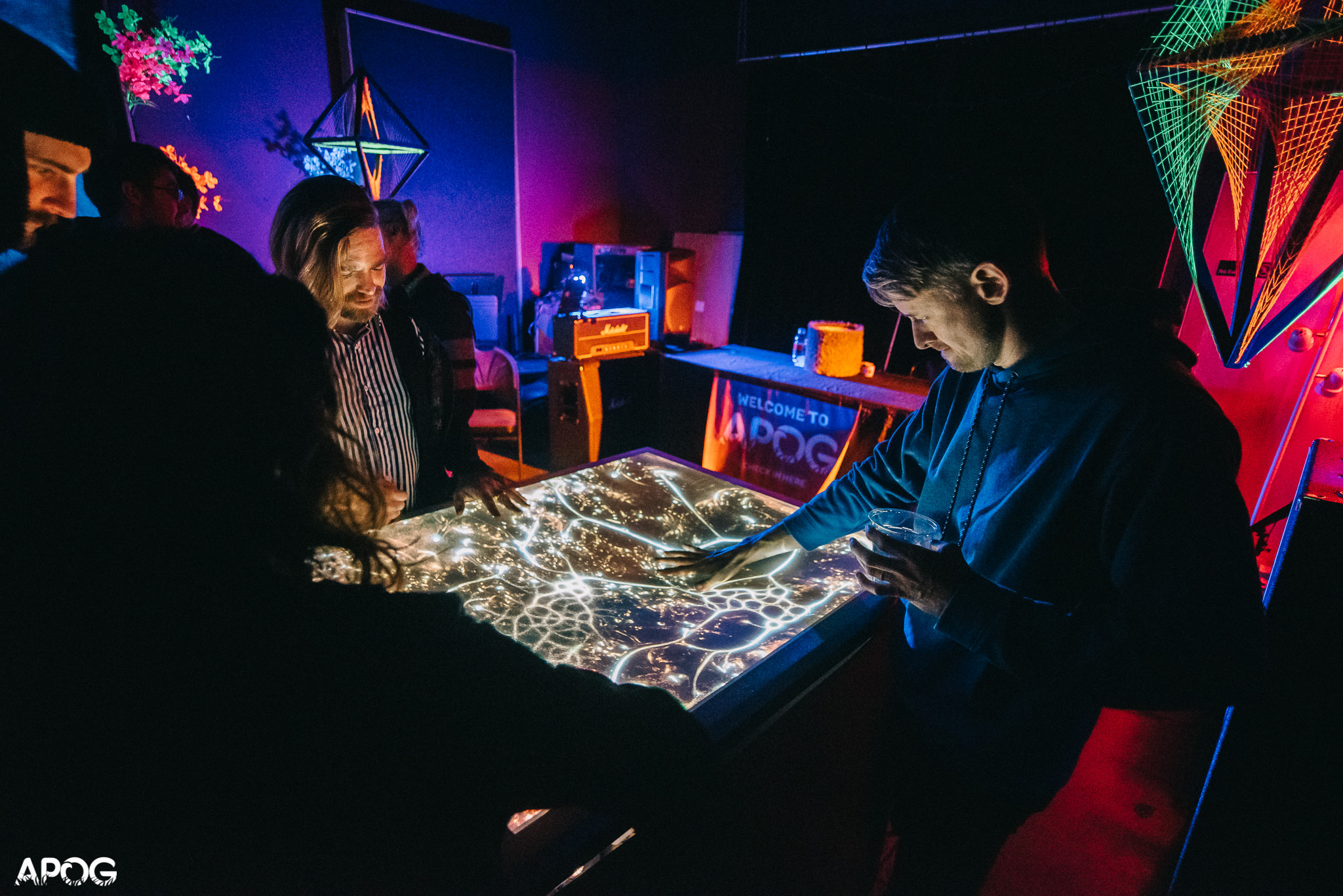 Visitors interacting with Nocturna at APOG Music Festival